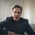 man relaxing with cigar
