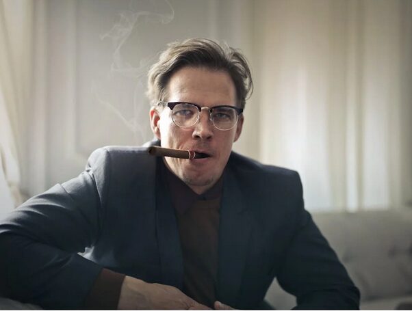 man relaxing with cigar